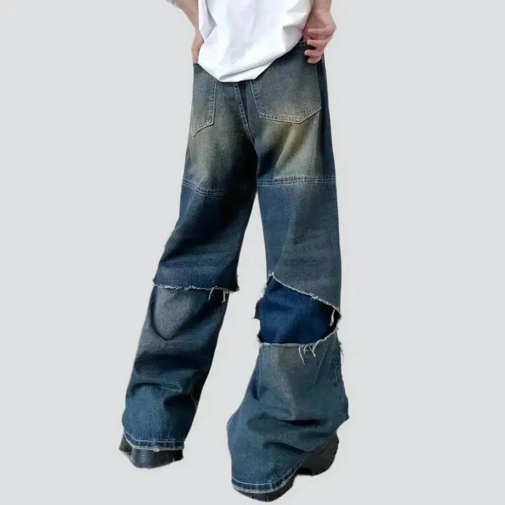 Layered men's whiskered jeans