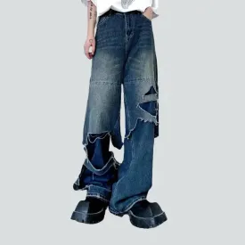 Layered men's whiskered jeans